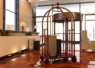 hotel reception desk with luggage