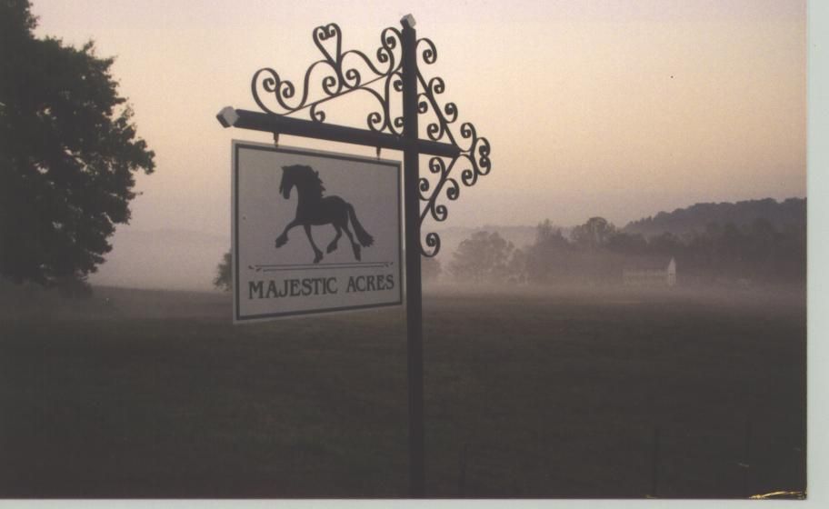 A majestic acres sign with a horse on it