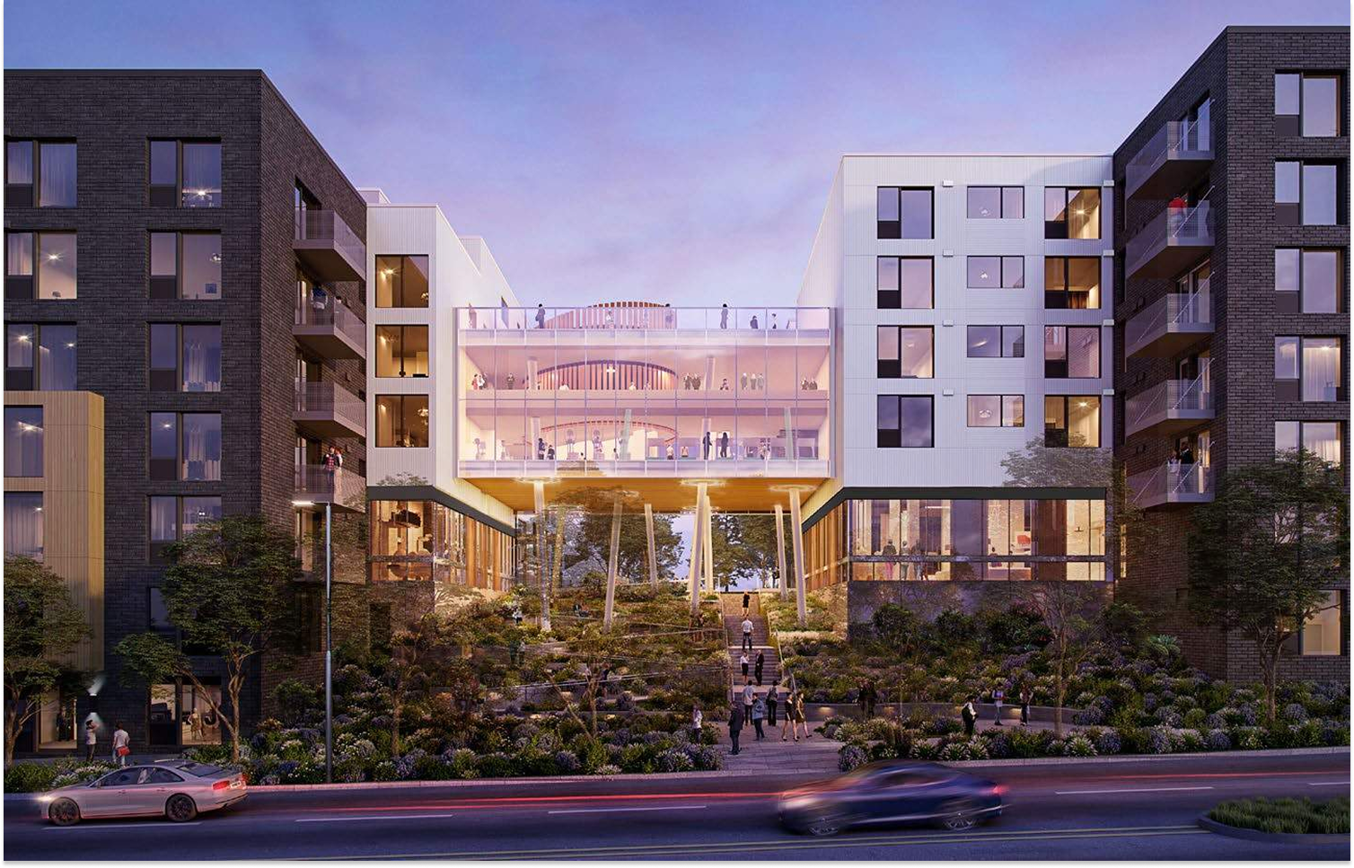 Modern apartment buildings framing a central courtyard at dusk with trees, lights, and parked cars