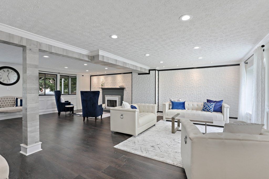 A living room filled with furniture and a fireplace