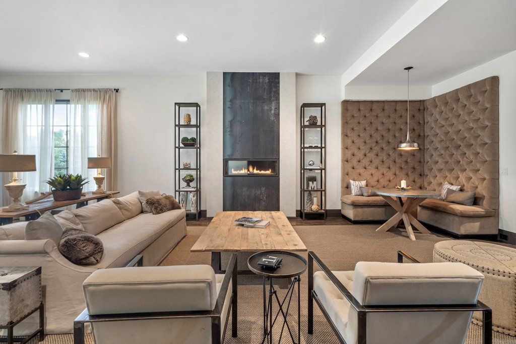A living room filled with furniture and a fireplace