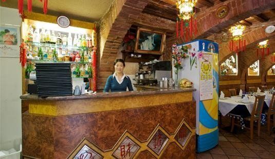 Restaurant employee behind the counter