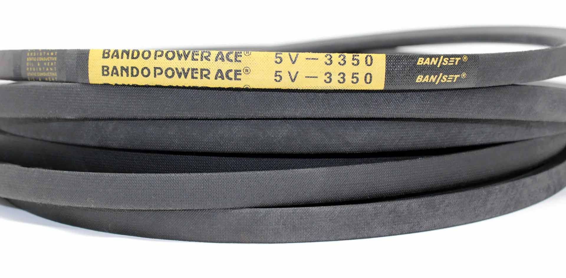 Black V-belts stacked, marked 
