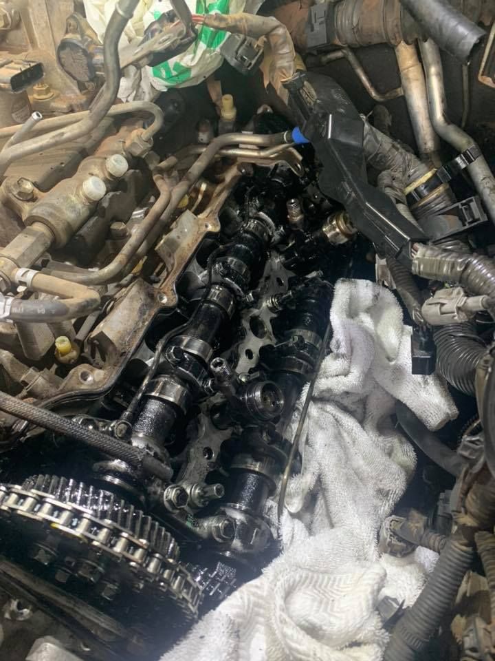 A Close Up Of A Car Engine With A Towel On Top Of It — Dieselflash Whitsundays in Airlie Beach, QLD