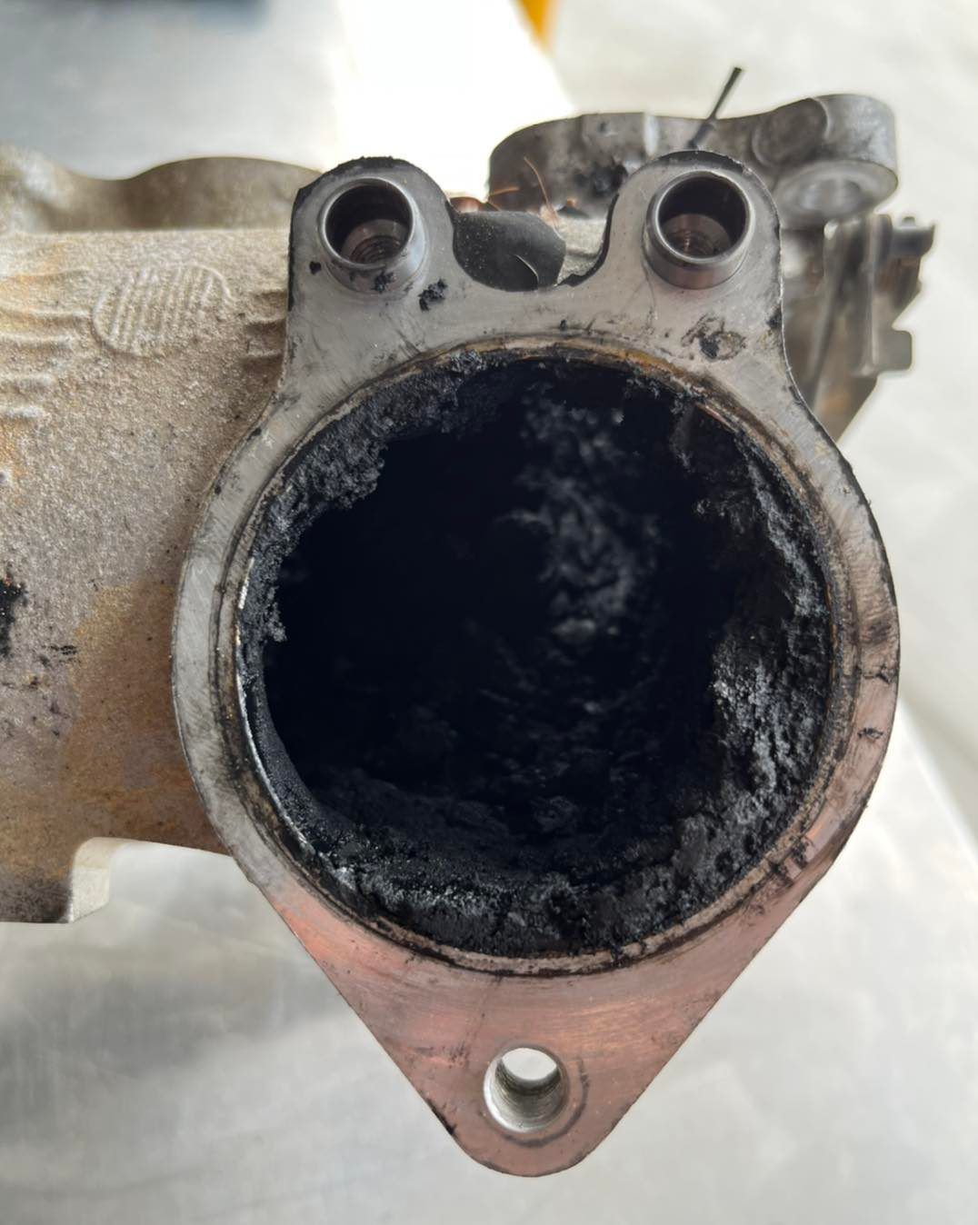 A Close Up Of A Piece Of Metal With A Hole In It — Dieselflash Whitsundays in Bowen, QLD