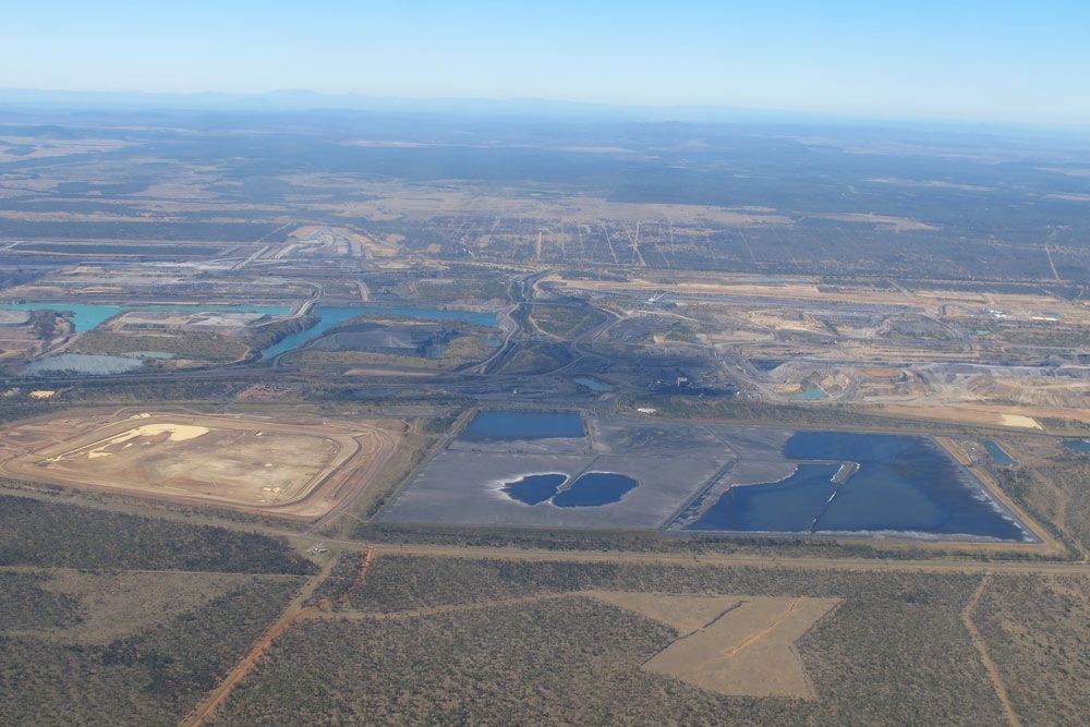 An Aerial View Of A Large Body Of Water In The Middle Of A Field — Dieselflash Whitsundays in Moranbah, QLD