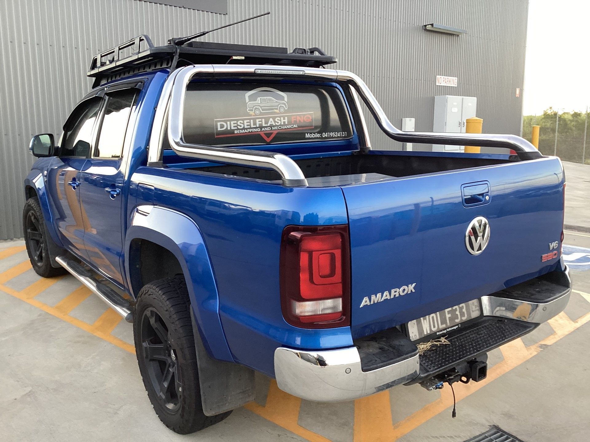 A Blue Volkswagen Amarok Is Parked In A Parking Lot — Dieselflash Whitsundays in Proserpine, QLD