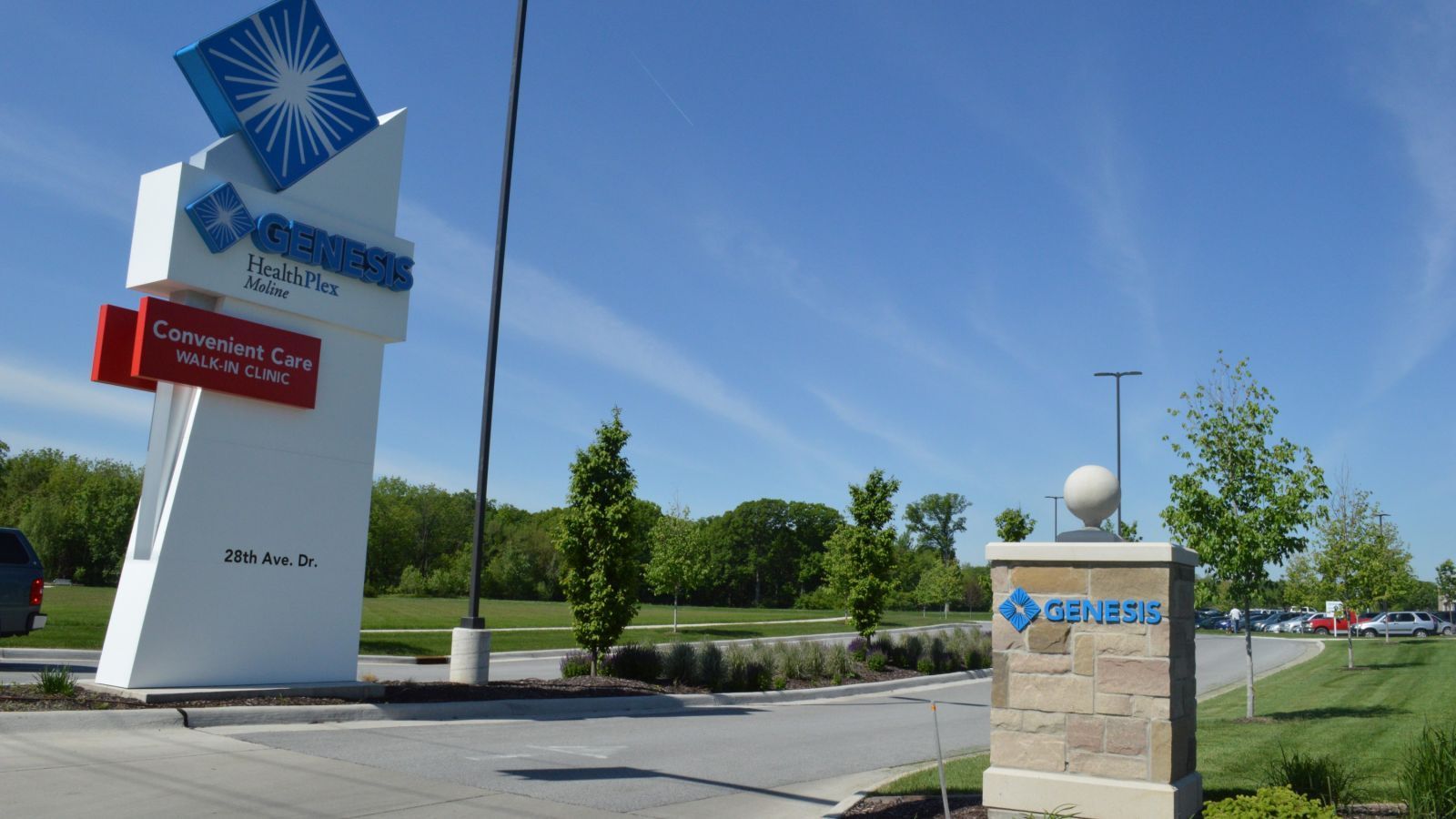 Sign for Sam's Club in Columbus, Ohio. A tall white sign with red and blue accents and a stone pillar entrance.