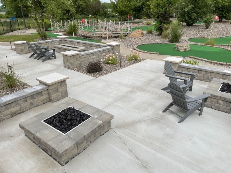 There is a fire pit in the middle of the patio.