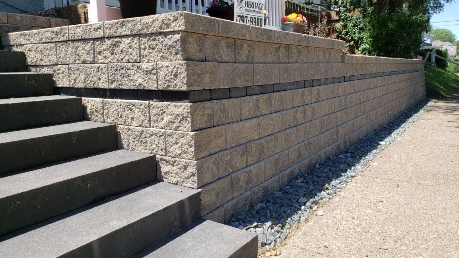 A brick wall with stairs leading up to it