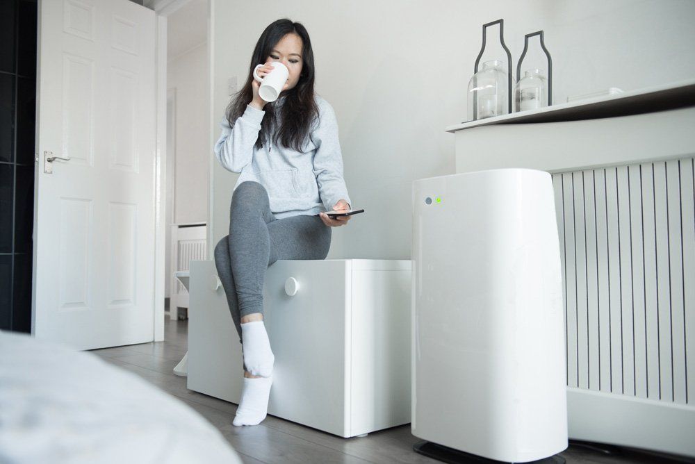 Woman Controls the Power of Her Smart Air Unit — Sewickley, PA — Sta So Cool HVAC