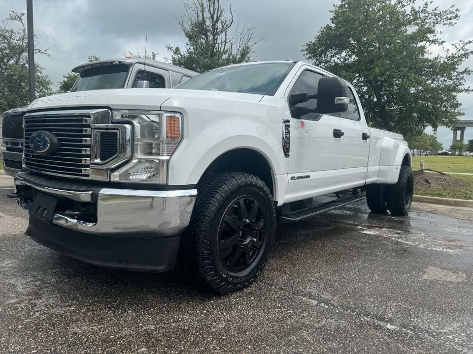 A person is cleaning a furnace with a vacuum cleaner.