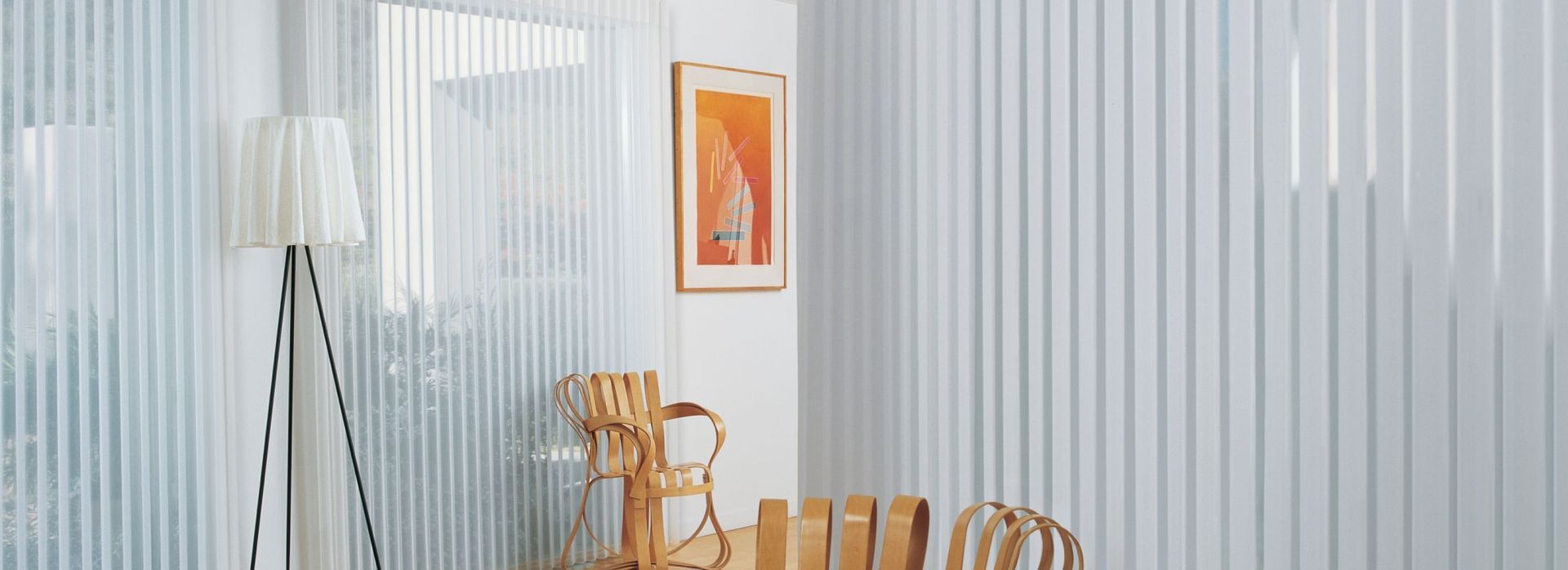 a kitchen with a large island and lots of windows with shutters All Window Decor (817) 448-3393