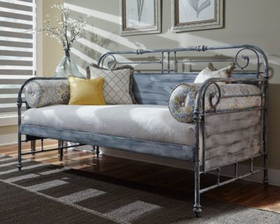 a day bed is sitting in a living room next to a window All Window Decor (817) 448-3393.
