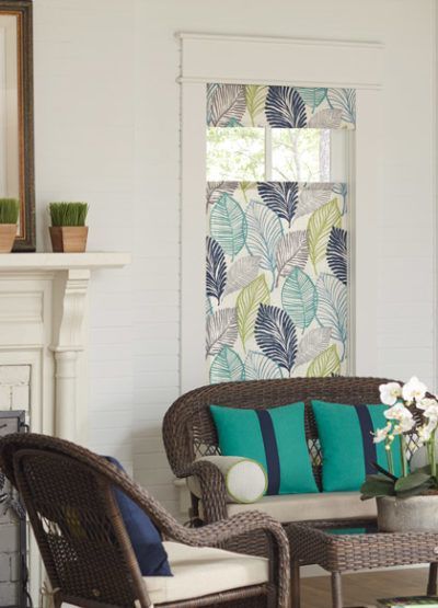 a living room with wooden shutters on the windows All Window Decor (817) 448-3393