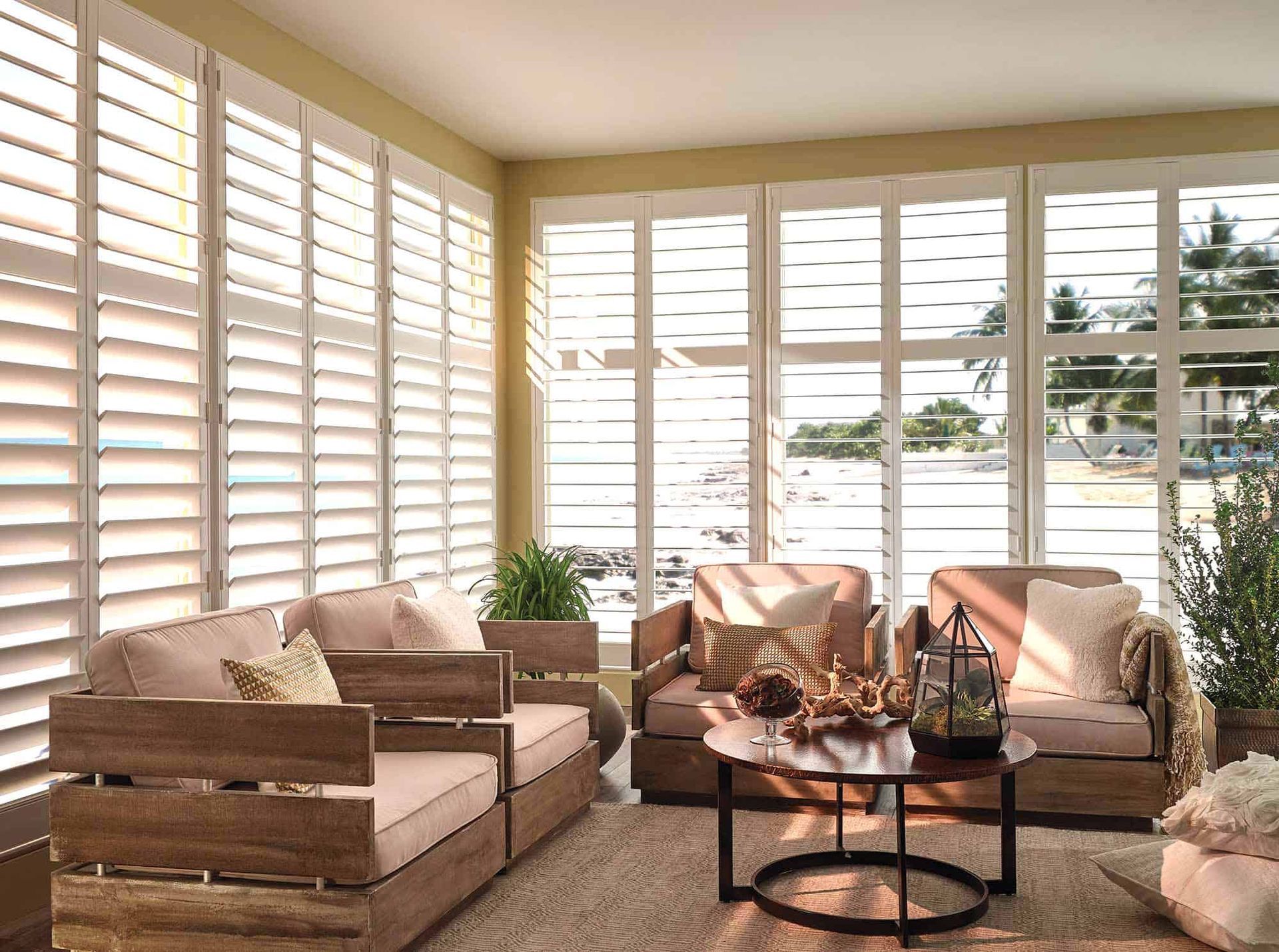 a living room with a lot of furniture and shutters on the windows All Window Decor (817) 448-3393