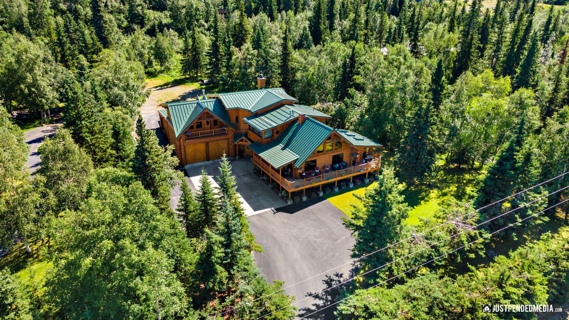 aerial photo of wooded home