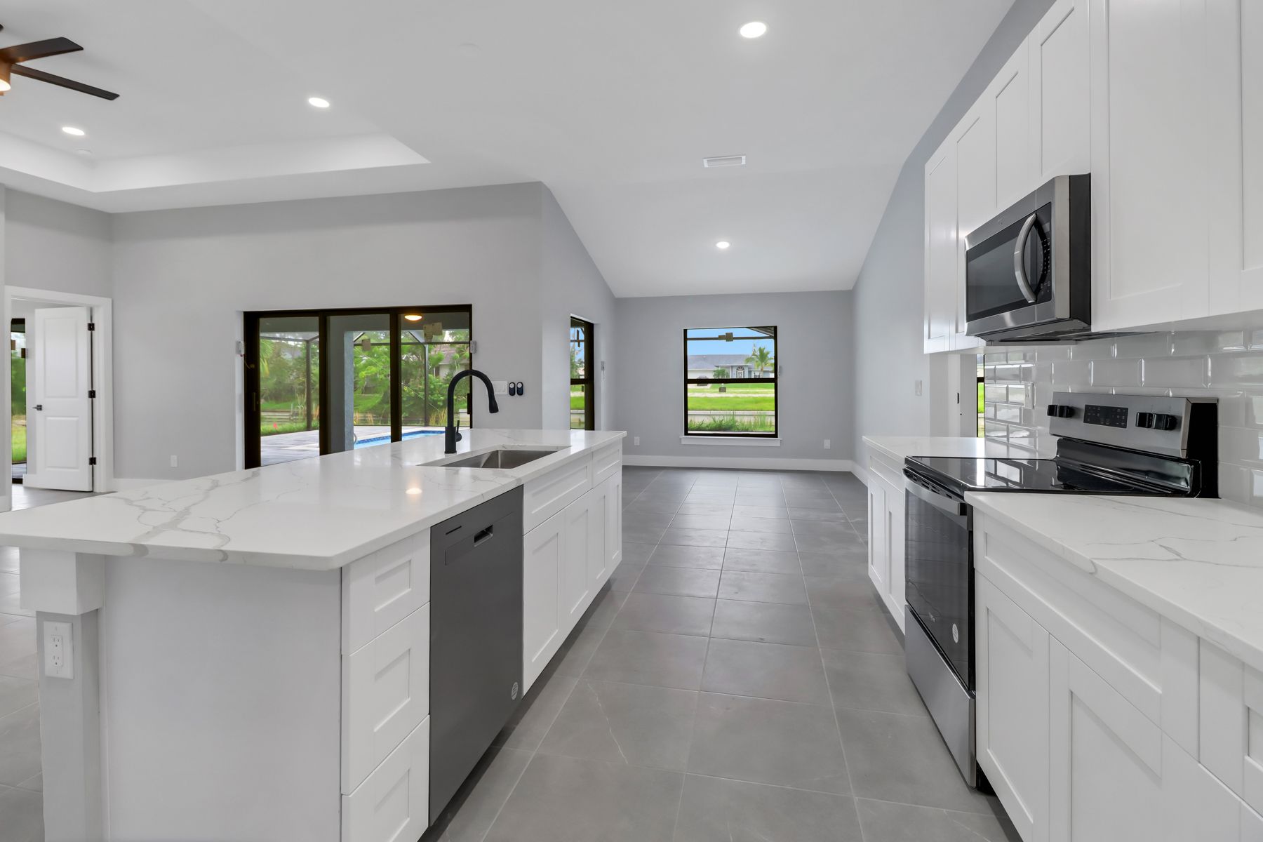 a bathroom with a sink , toilet , tub and shower .
