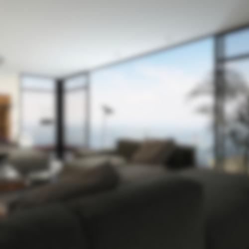a blurry picture of a living room with a view of the ocean