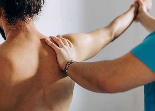 Chiropractor Doing Shoulder Adjustment — Wichita, KS — Advanced Chiropractic