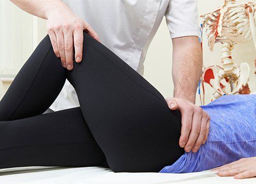 Treating Female Patient With Hip Problem — Wichita, KS — Advanced Chiropractic