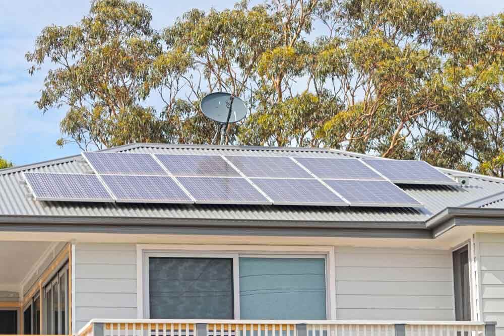 A House With Solar Panels And A Satellite Dish On The Roof — IPOWER Industries In Proserpine, QLD