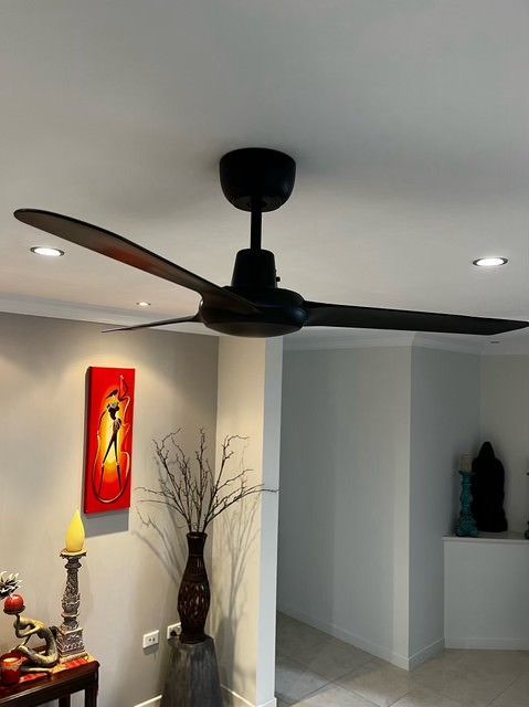 A Living Room With A Ceiling Fan And A Painting On The Wall — IPOWER Industries In Airlie Beach, QLD