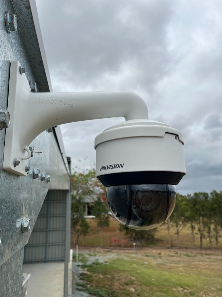 A Security Camera Is Mounted On The Side Of A Building — IPOWER Industries In Strathdickie, QLD