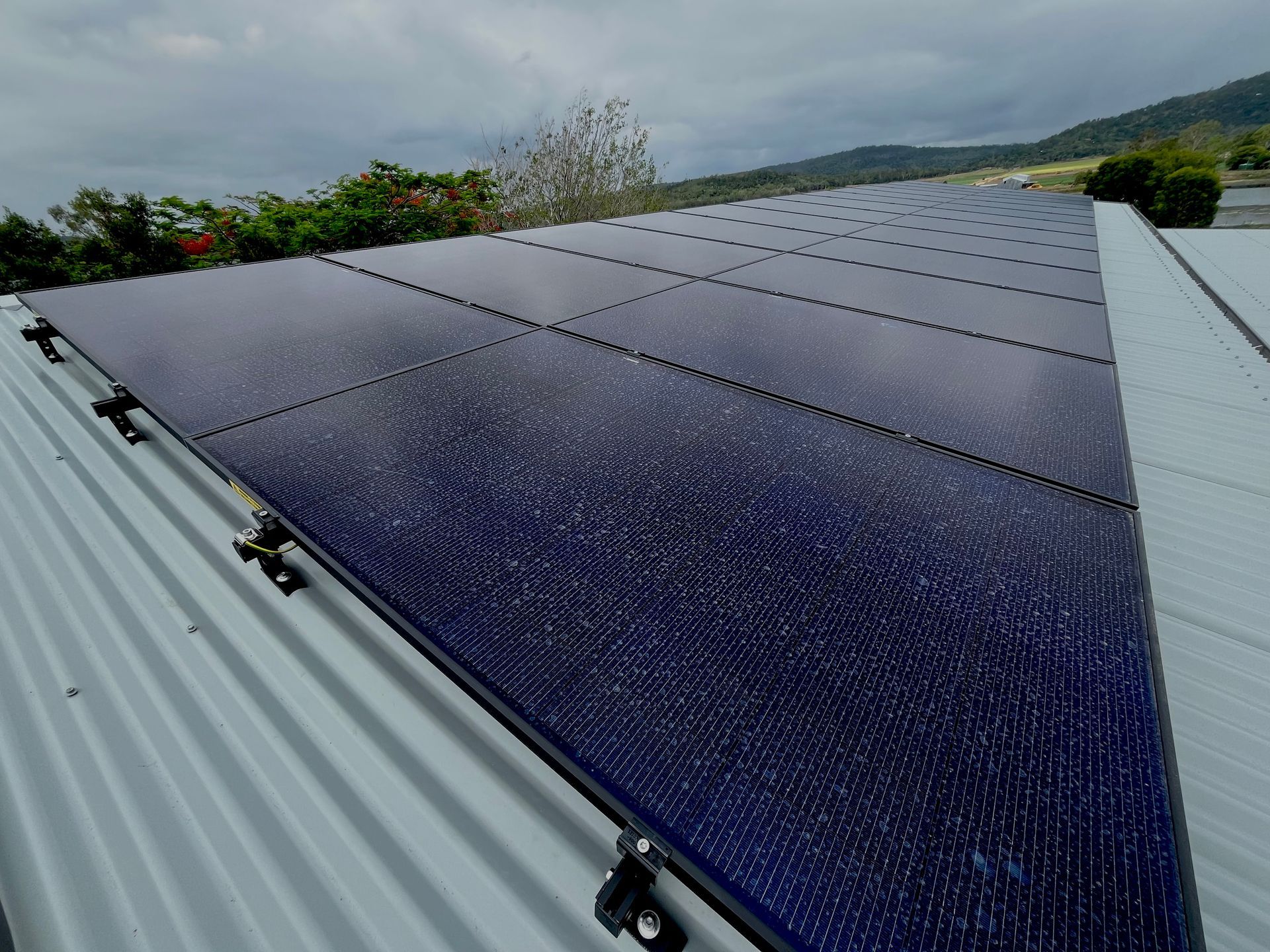 A Roof With A Lot Of Solar Panels On It — IPOWER Industries In Strathdickie, QLD