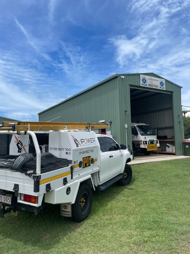 A White Truck Is Parked In Front Of A Building — IPOWER Industries In Strathdickie, QLD