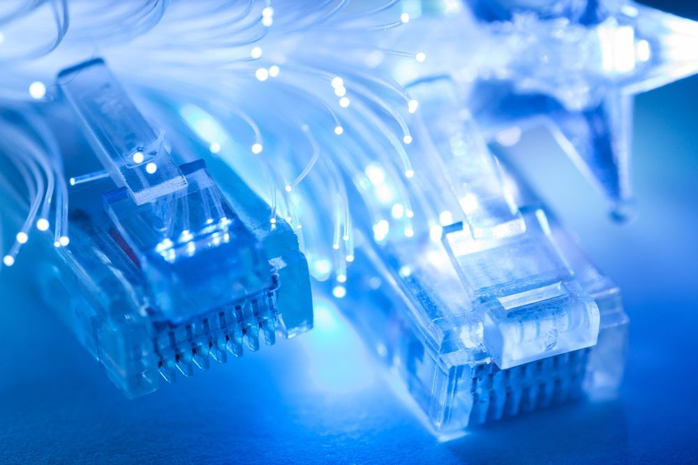 A Bunch Of Blue And Yellow Wires Are Connected To A Server — IPOWER Industries In Strathdickie, QLD
