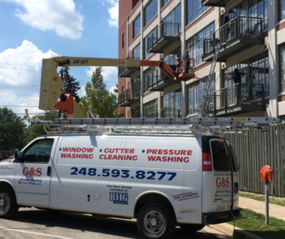 G&S Property Services washing windows in Ann Arbor, MI