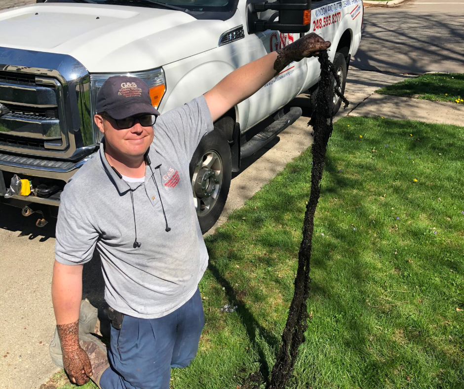 G&S employee with dirty underground drain