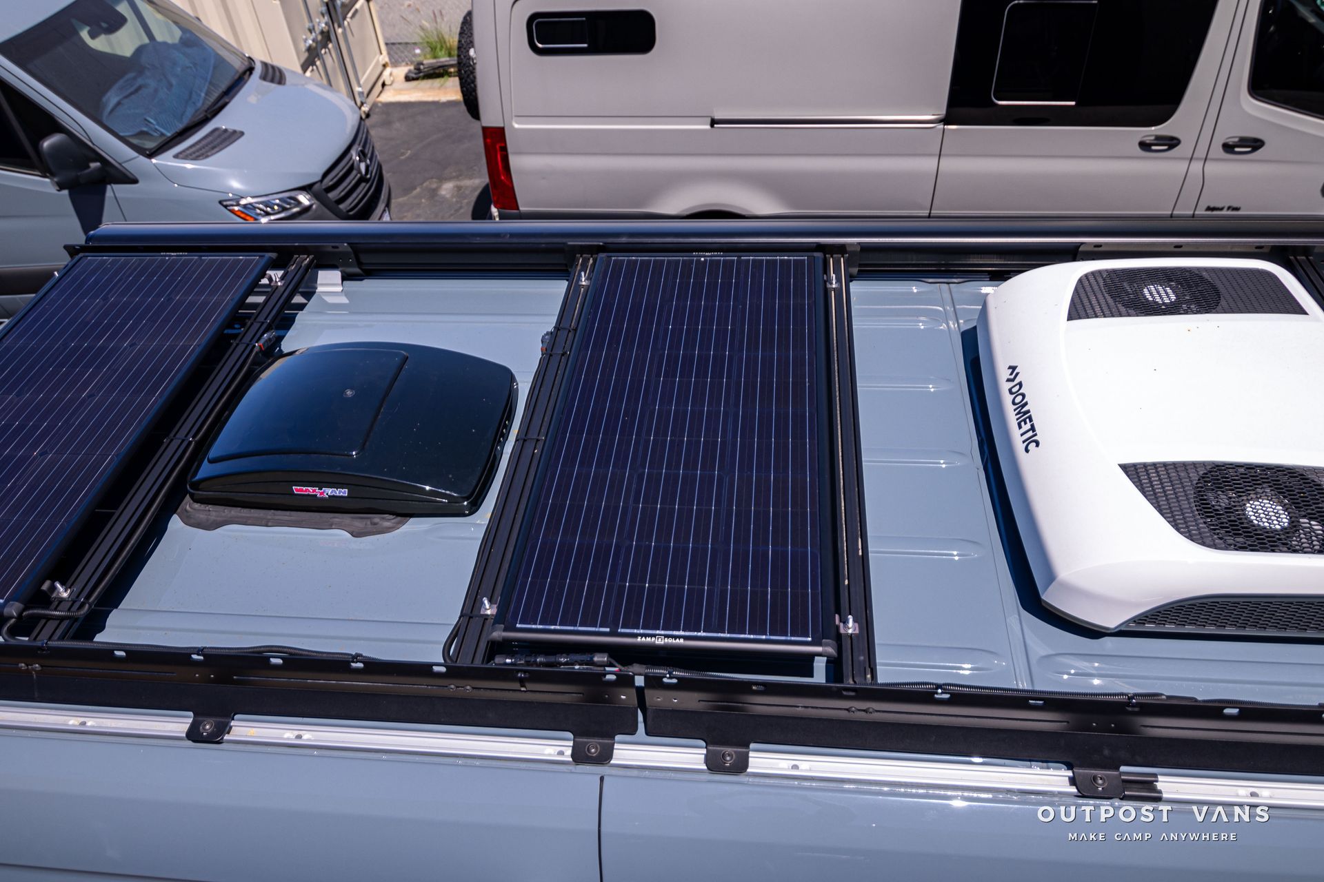 A van with solar panels on top of it