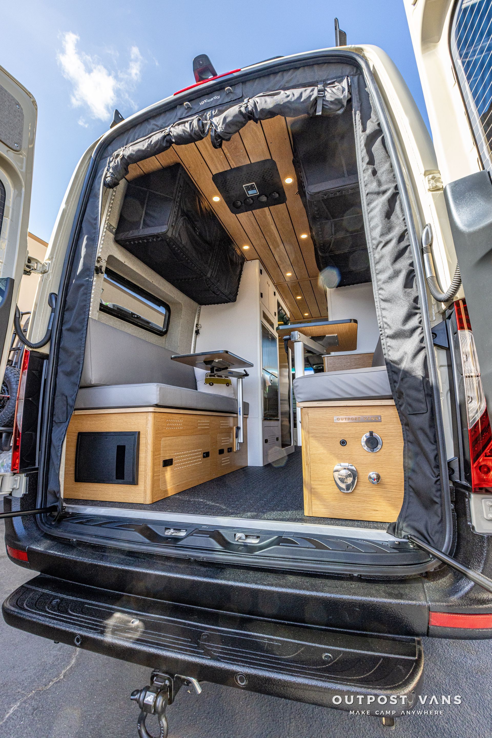 The back of a camper van with the door open.
