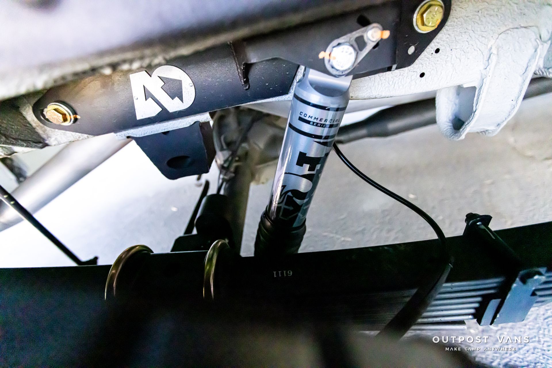 A close up of a shock absorber on a vehicle