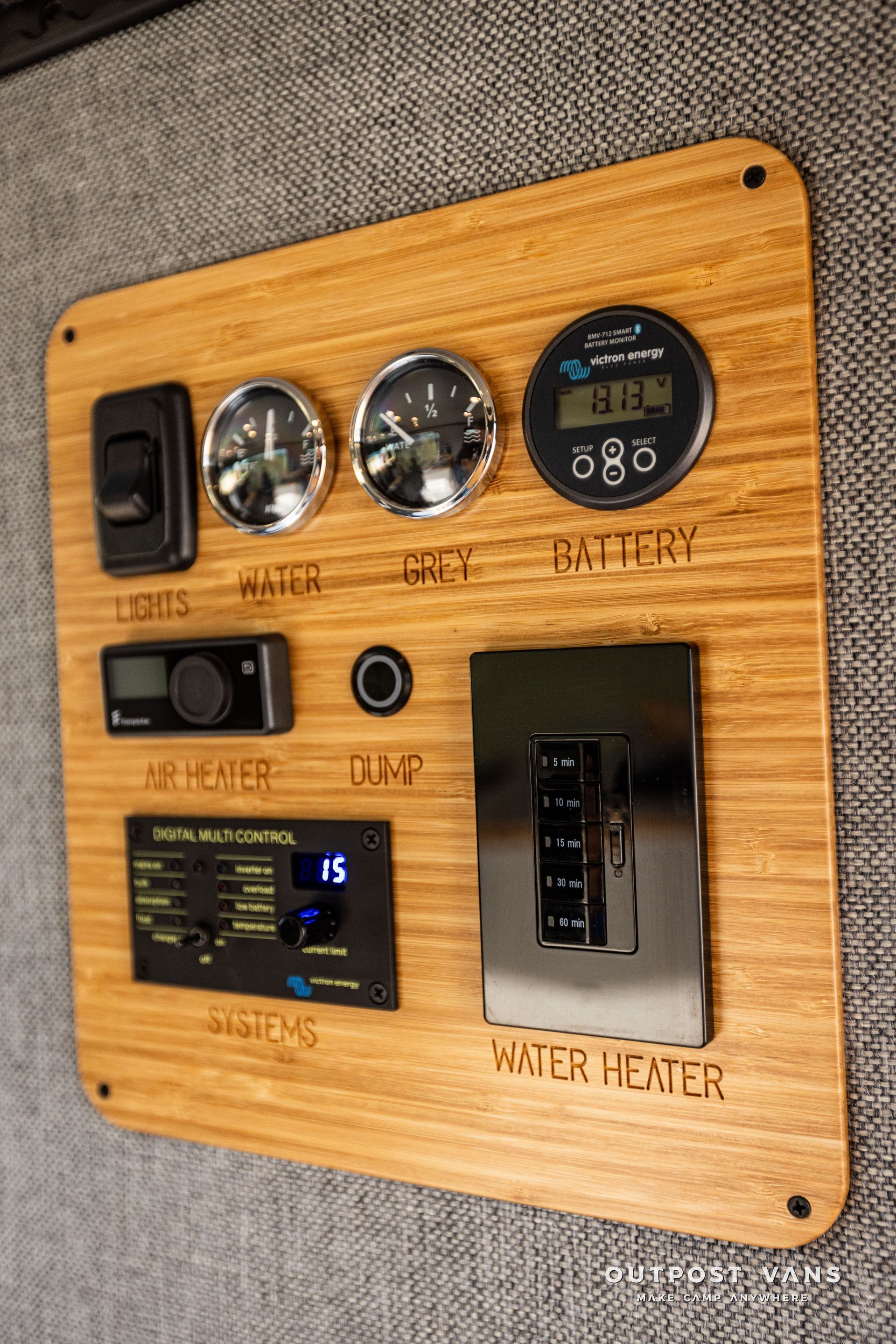 A wooden panel with a lot of electronics on it.