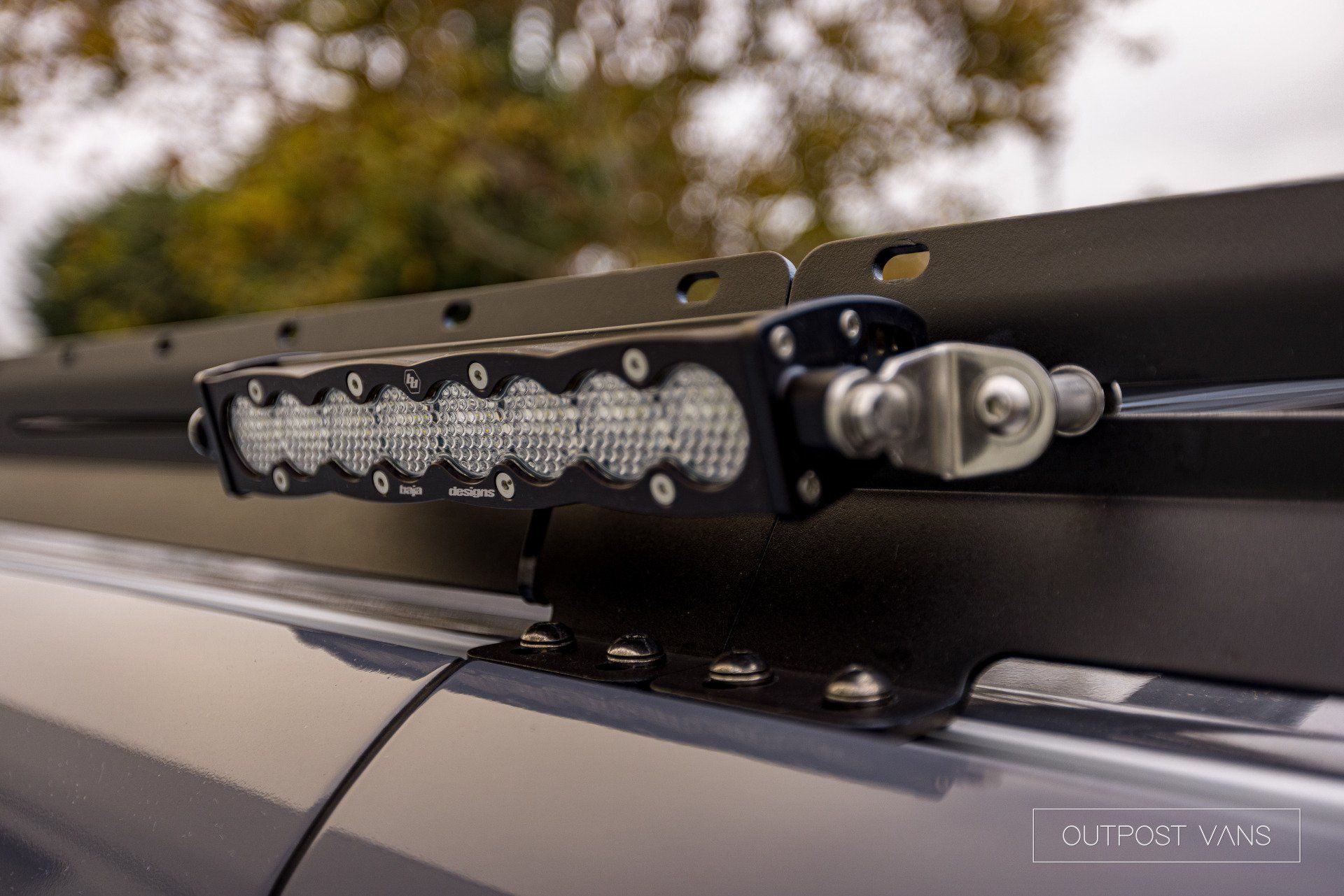 A close up of a roof rack with a light on it.