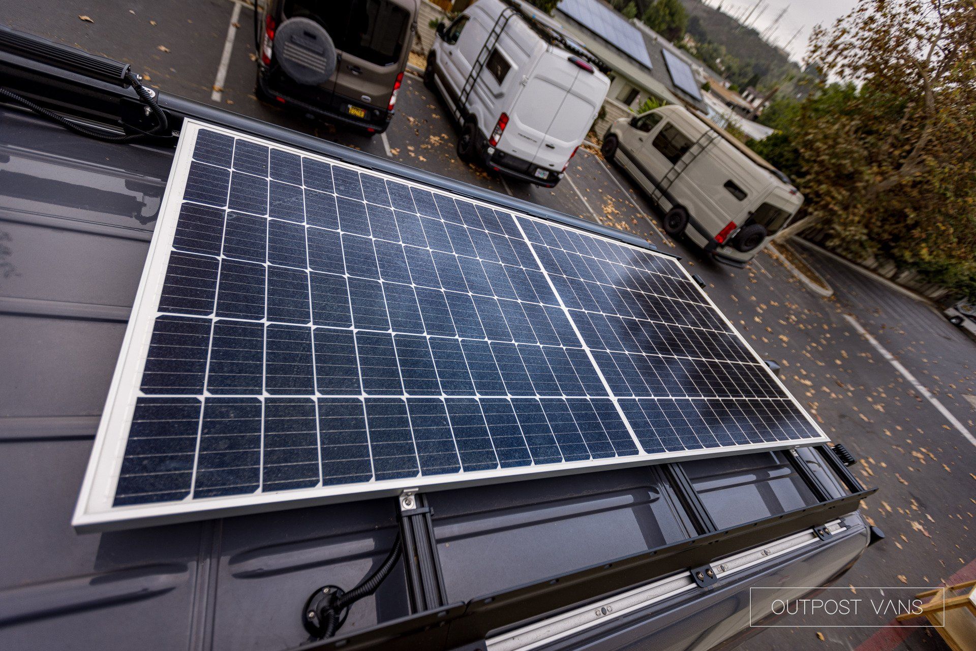 A solar panel is sitting on top of a van.