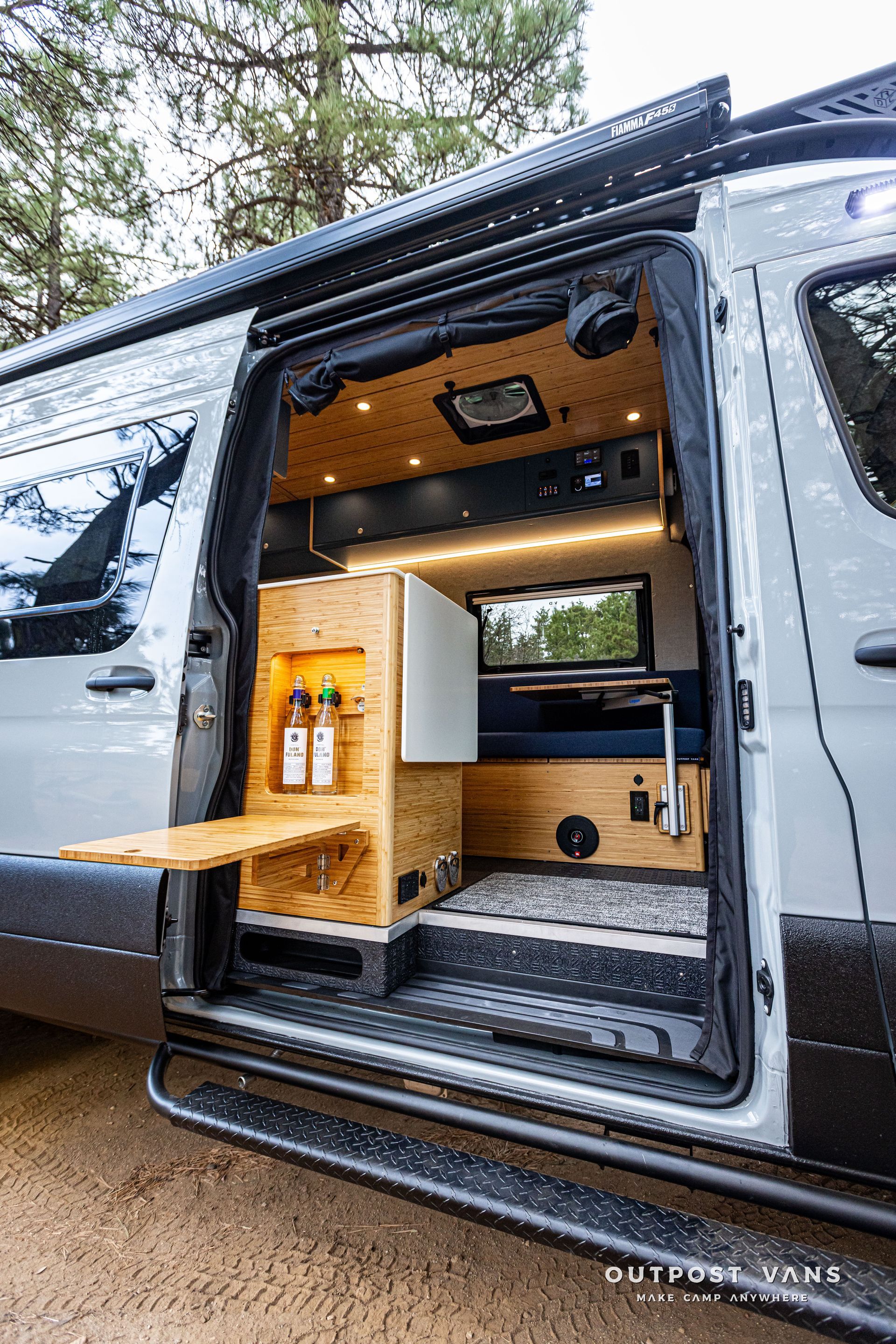 The inside of a camper van with the door open.