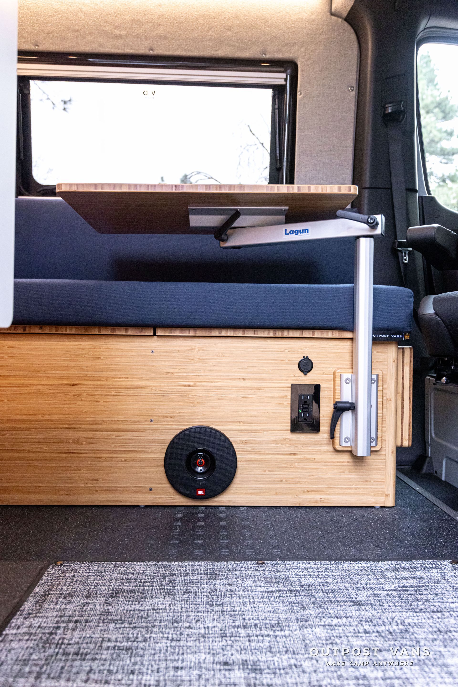 There is a table in the back of a van.