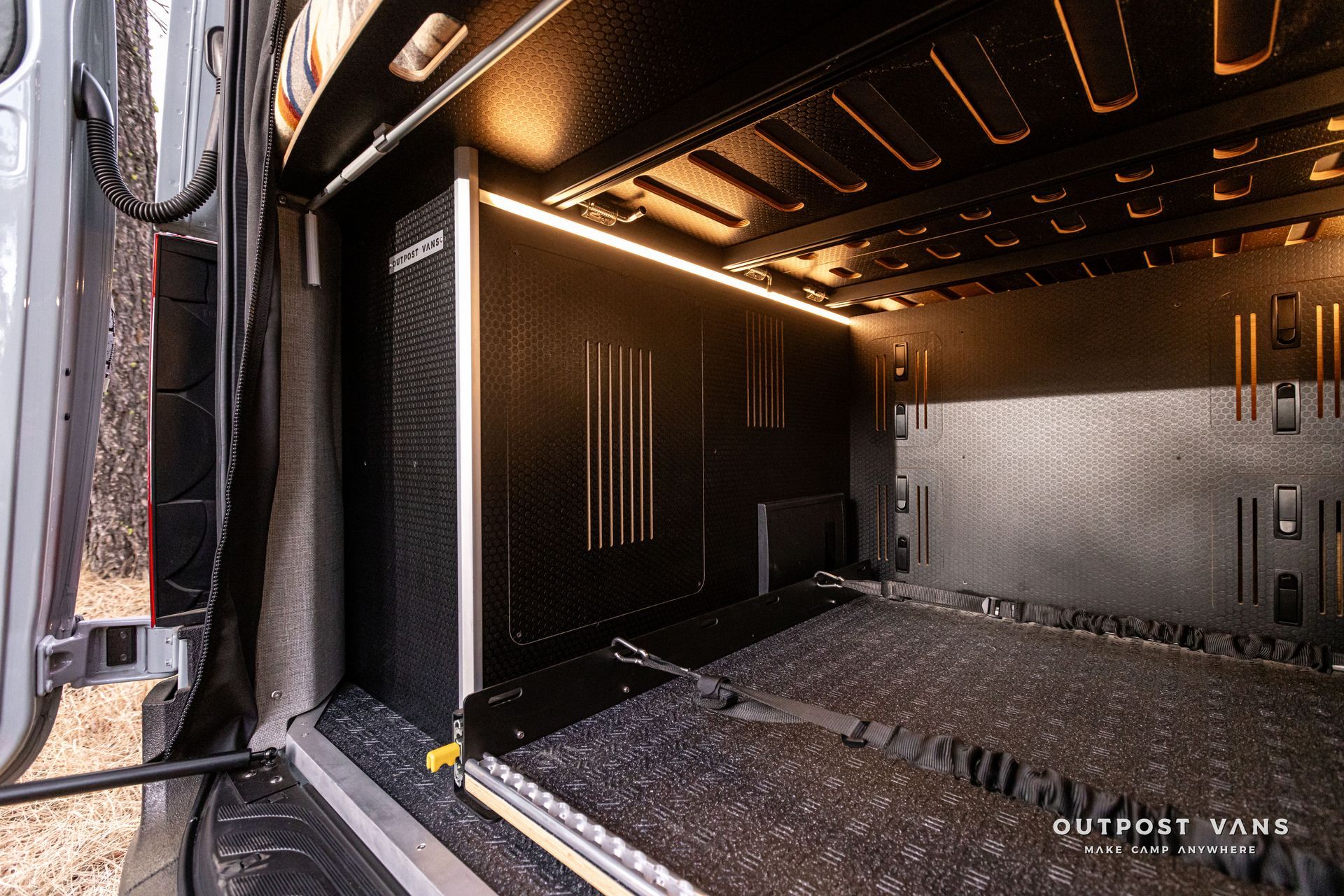 The inside of a van with the door open.