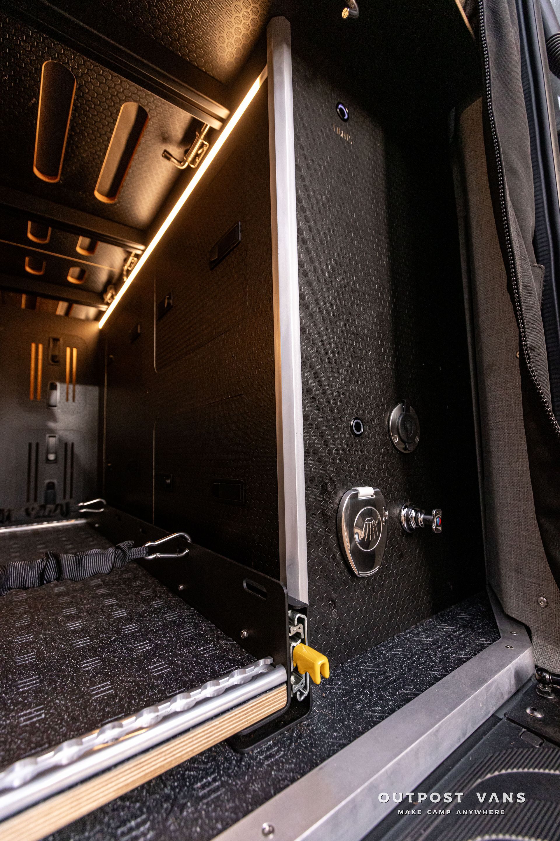 A close up of a door in a car with a light on it.