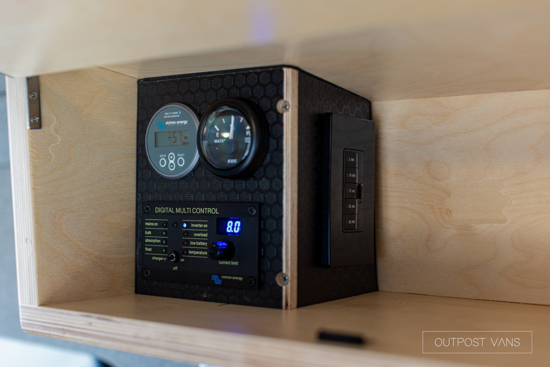 a shelf with a clock and a thermometer on it .