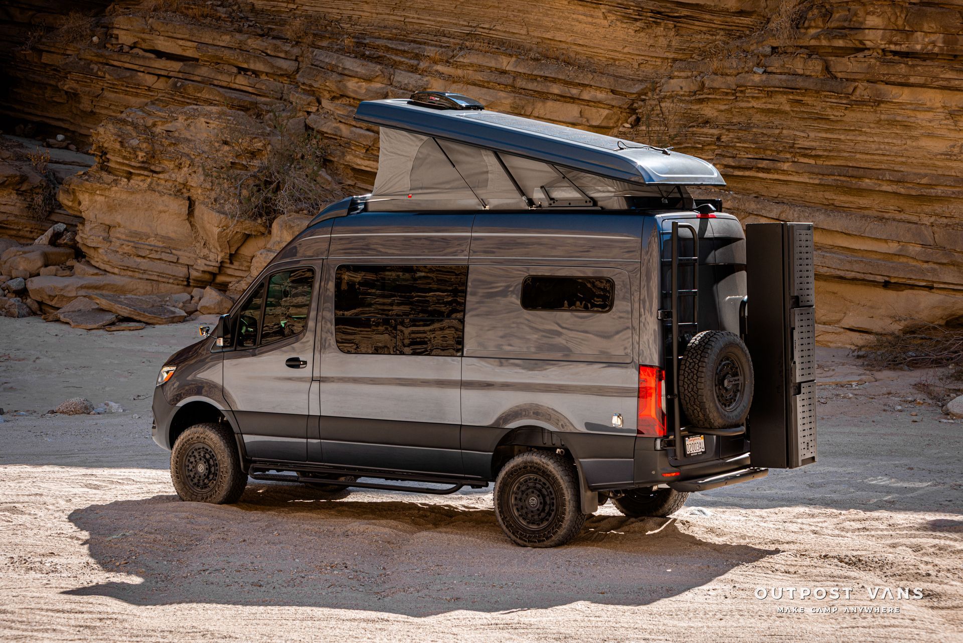 A sprinter van with a sca pop åtop at Fish Creek Anza Borrego
