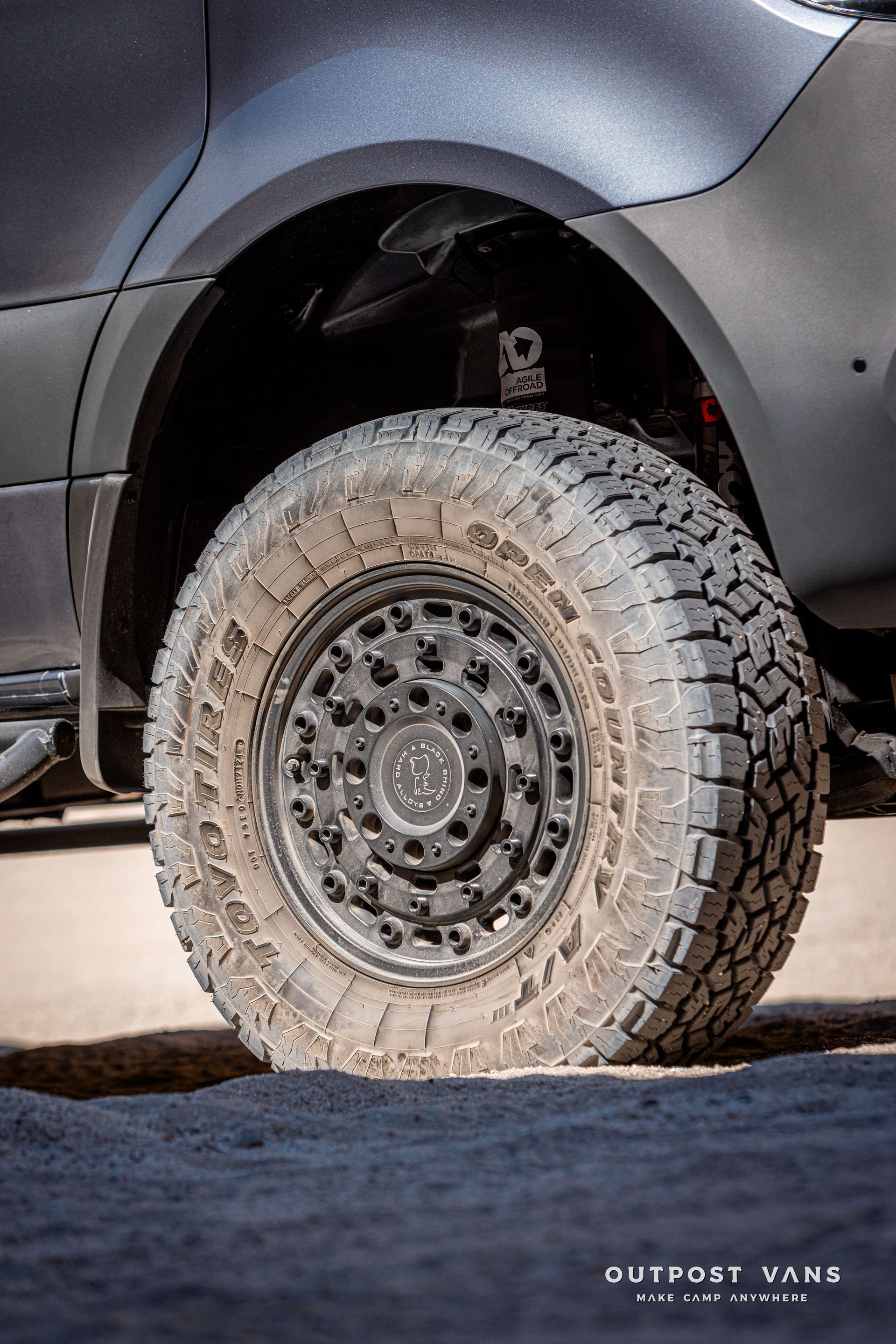 sprinter van with black Rhino Arsenal wheels and toyo open-country tires
