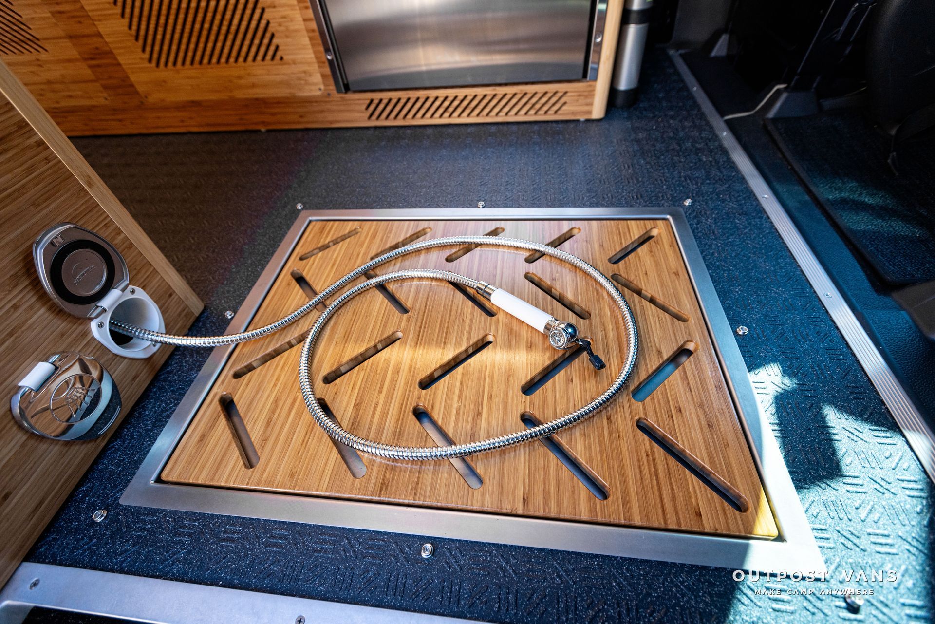 outpost vans in floor shower pan with bamboo insert shower hose and mixer