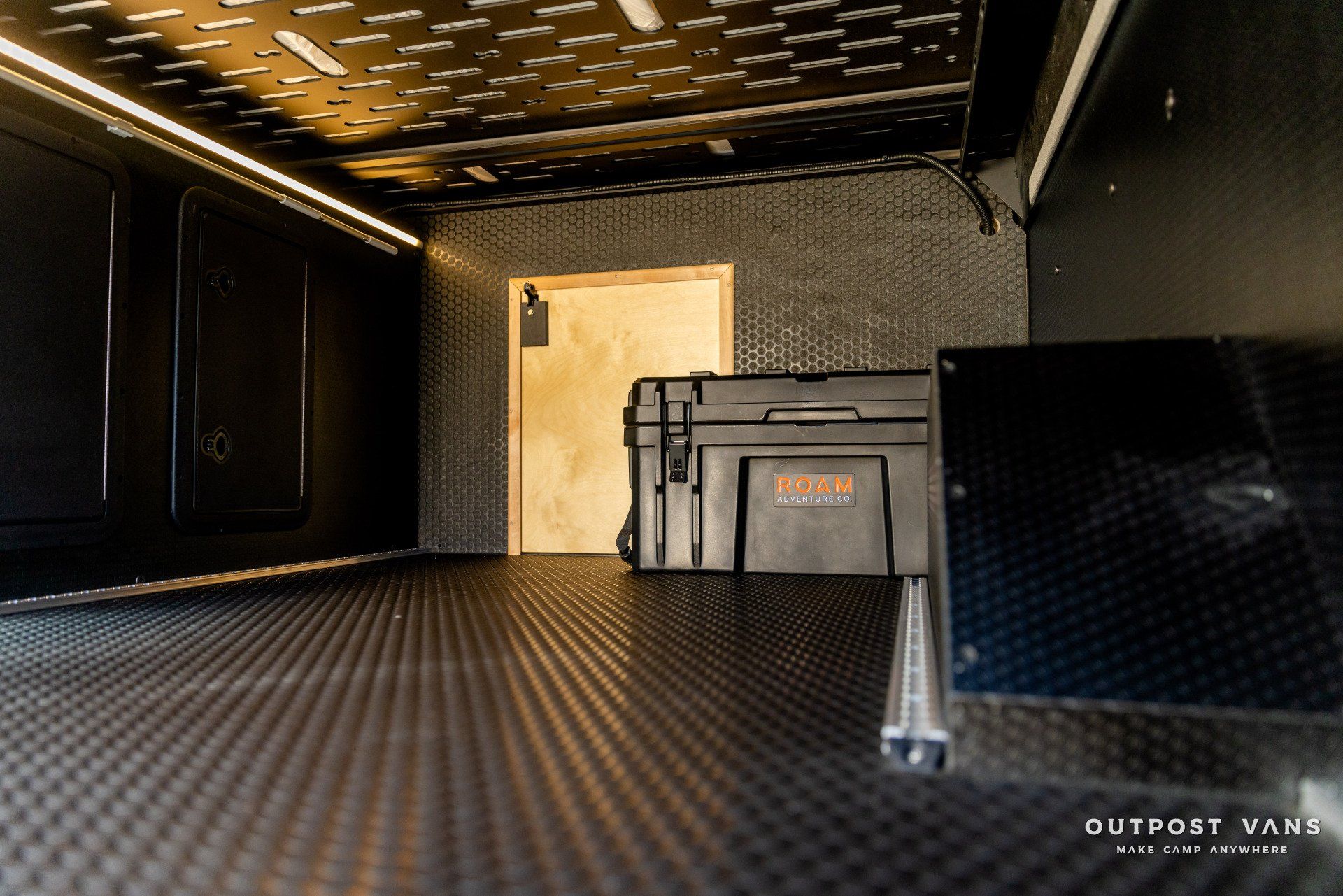 the inside of a van with a toolbox on the floor .