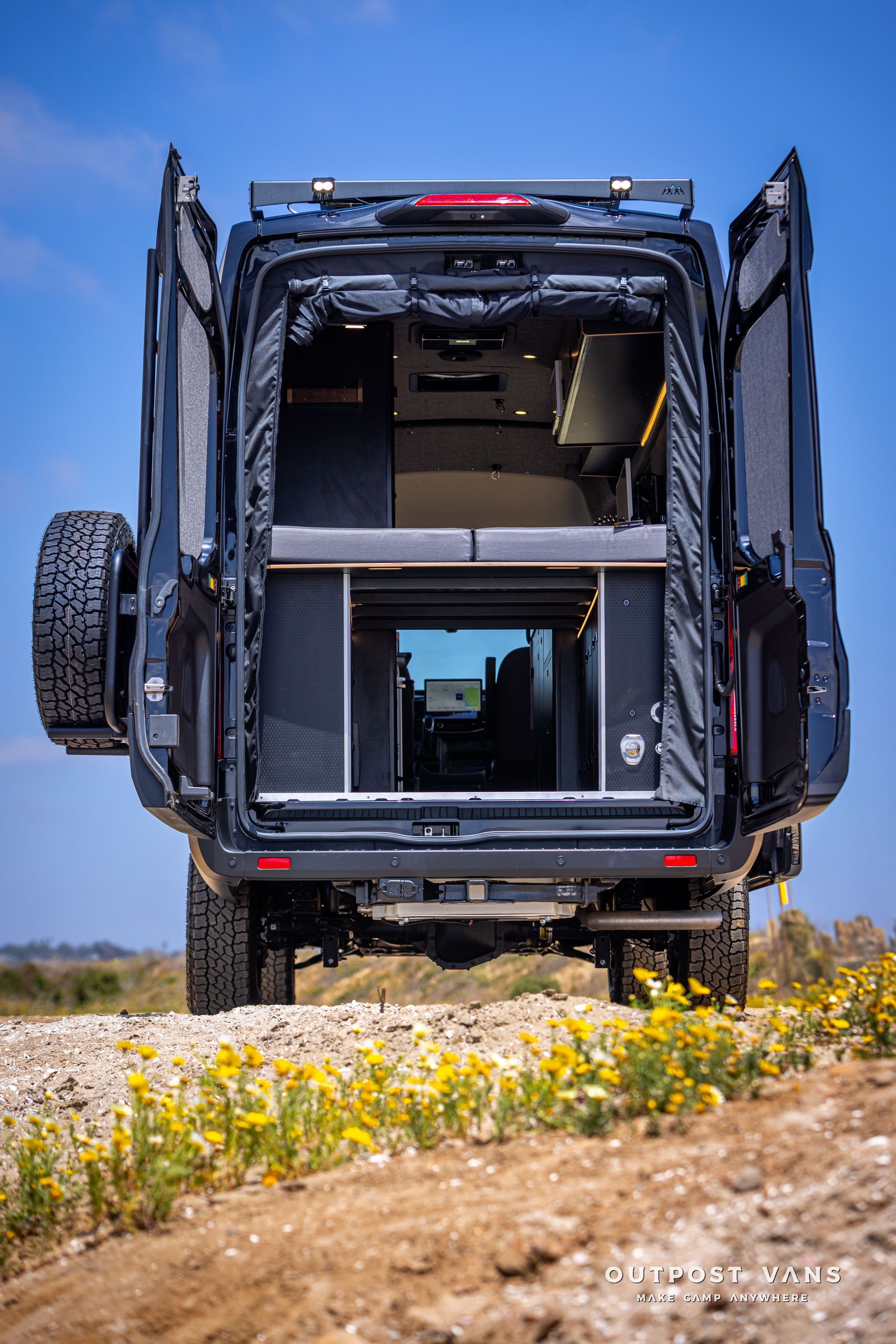 Outpost Vans custom built camper van Ford Transit 148 AWD