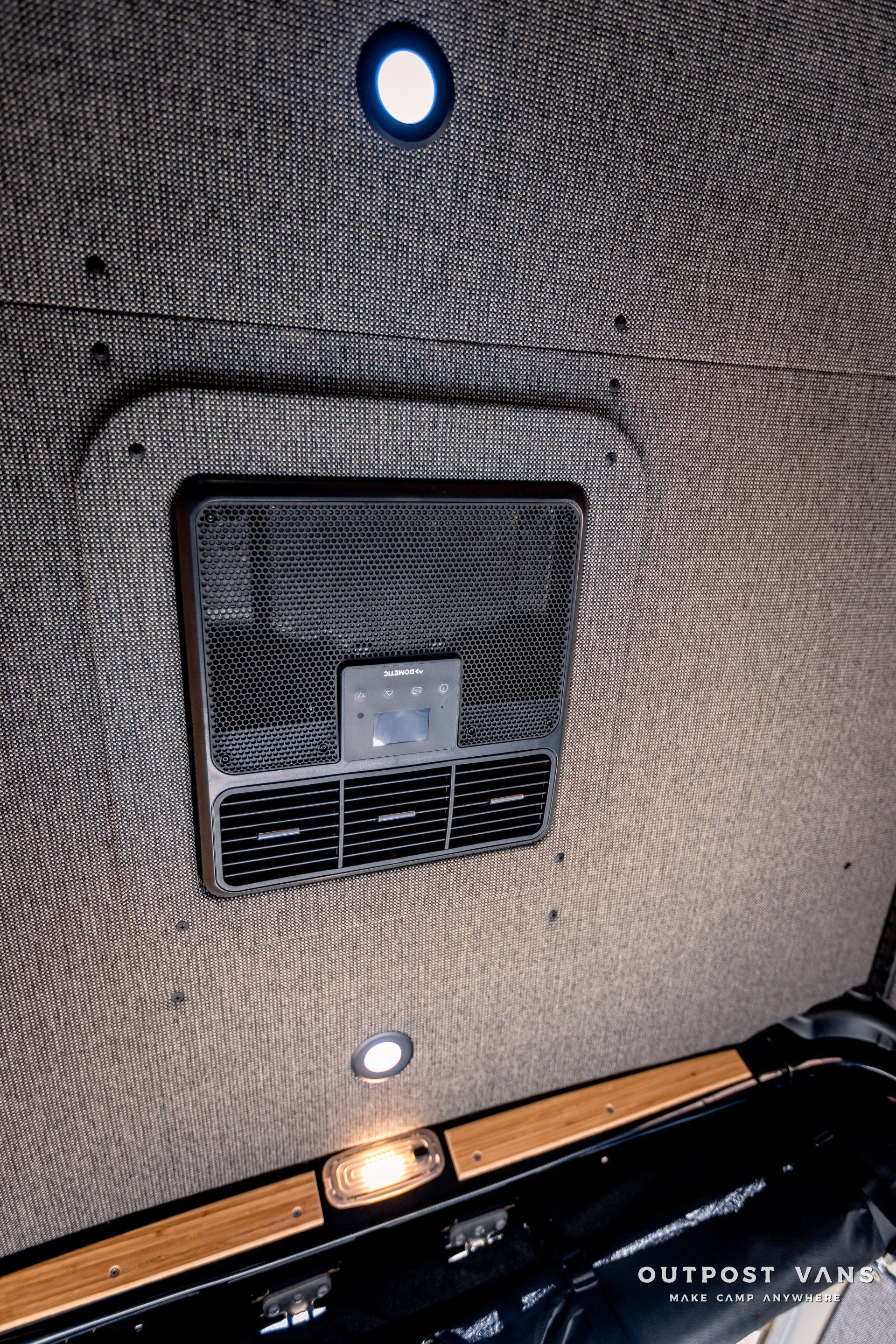 A close up of a ceiling with a light on it.